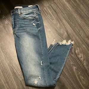 Slightly distressed denim skinny jeans